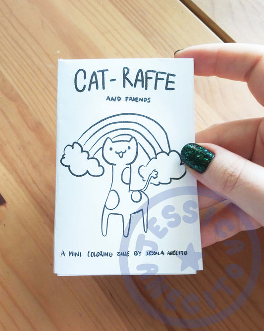 a small paper booklet features a drawing of a cat's head on a giraffe's body and the text: Cat-Raffe and Friends a mini coloring zine by Jessica Anecito